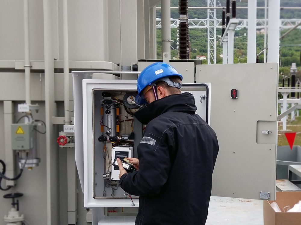 Installation of an OPT100 DGA monitor next to a transformer at a substation